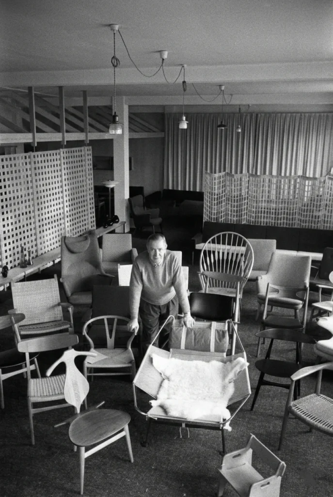 Iconic mid-century modern furniture designed by Hans J. Wegner, featuring the Wishbone Chair.