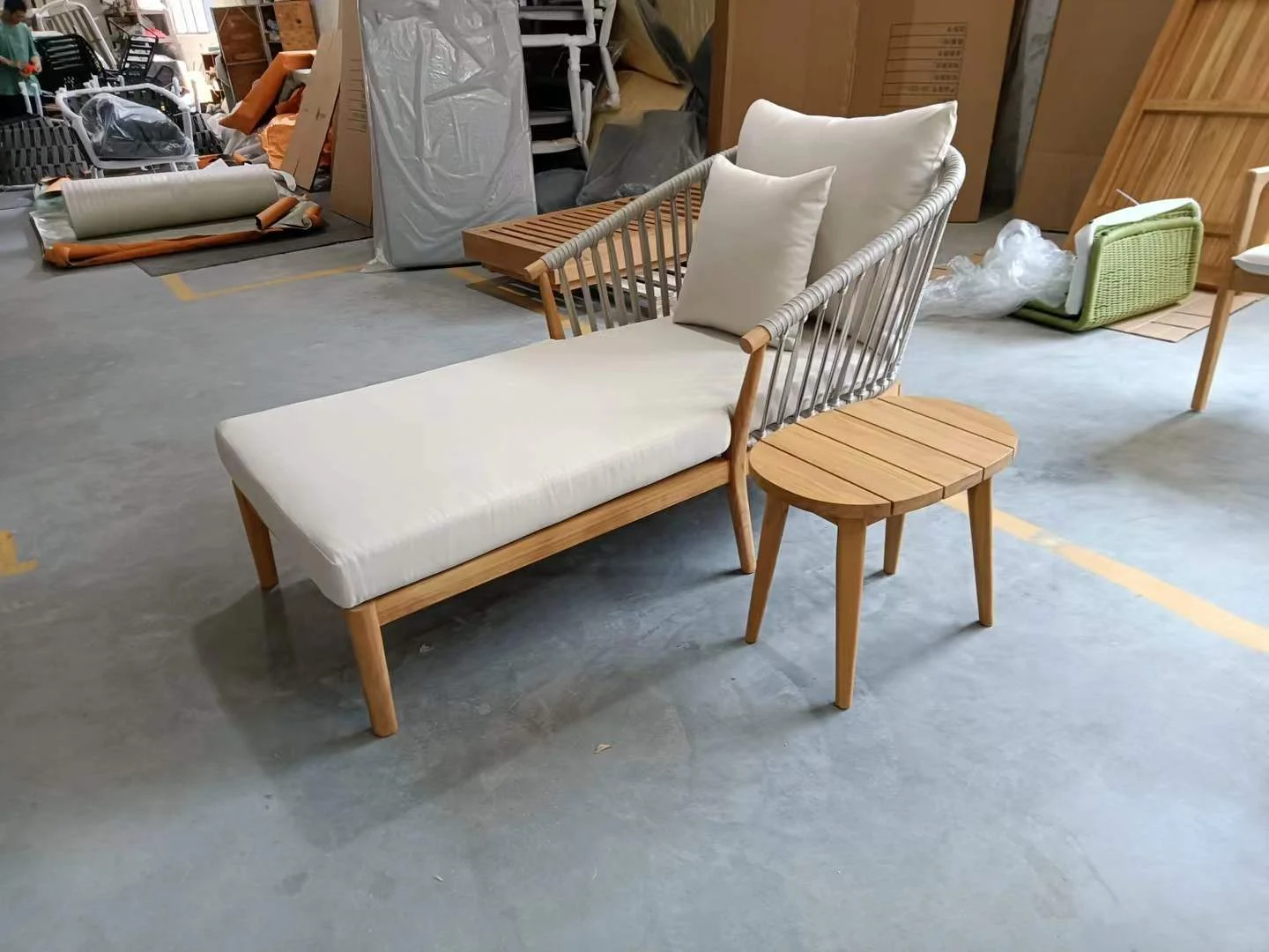 Teak sun lounger with side table for outdoor lounge spaces